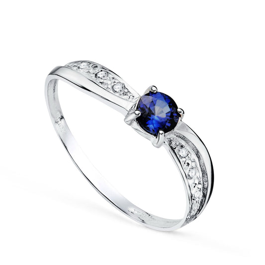 Bague solitaire saphir bordée de zirconium, Or blanc 18K.