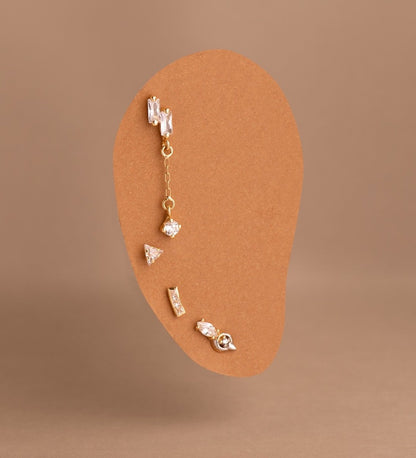 Piercing long zircon sertis clos , OR 18K. - PARADOXE